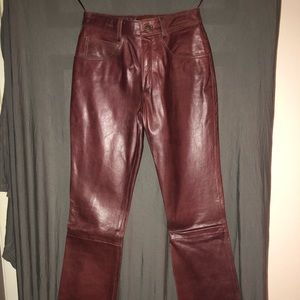 Maroon/burgundy colored leather pants. Wilson’s